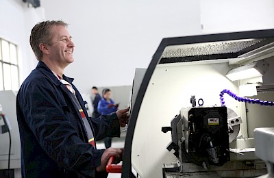 laughing man at machine